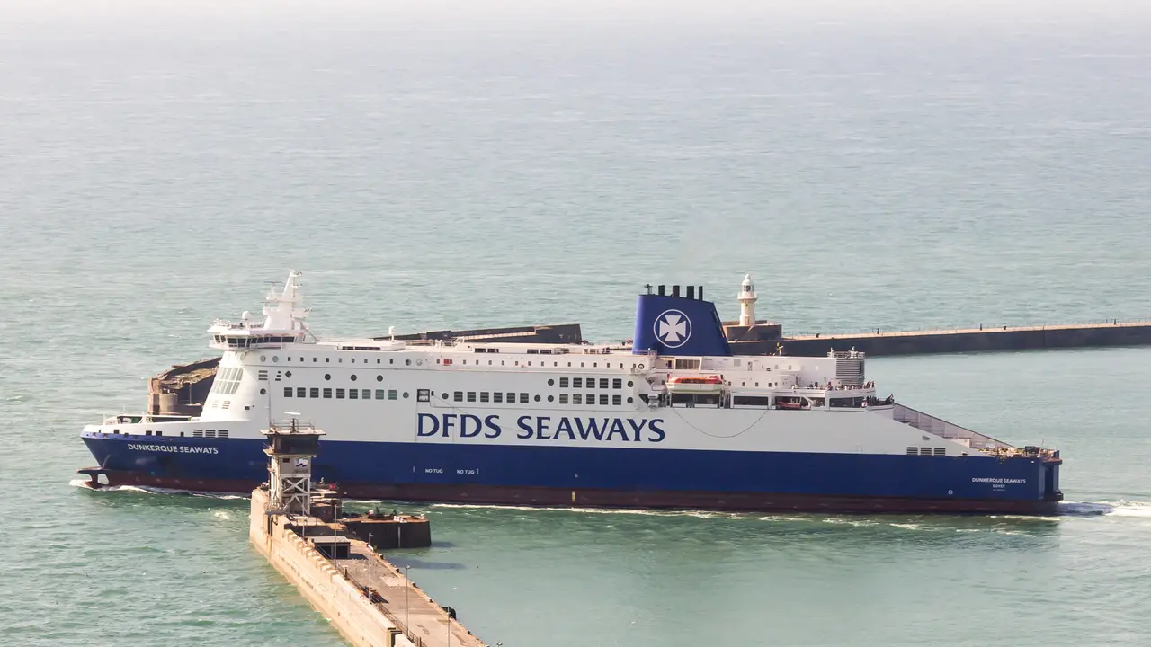 A large cross-Channel car ferry sailing out past the harbour wall at the Port of Dover
