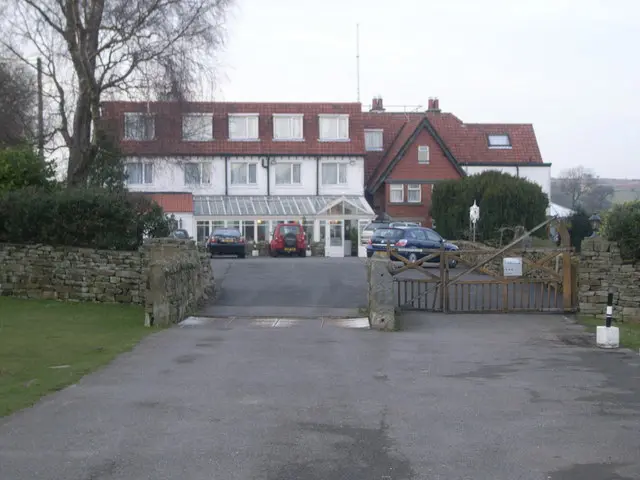 The Inn on the Moor at Goathland, a long white and red-brick building at the end of its driveway